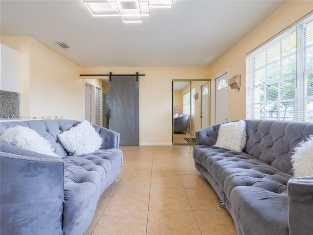 tiled living room with a barn door