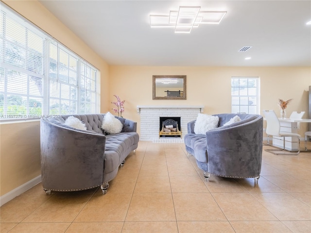 tiled living room featuring a fireplace