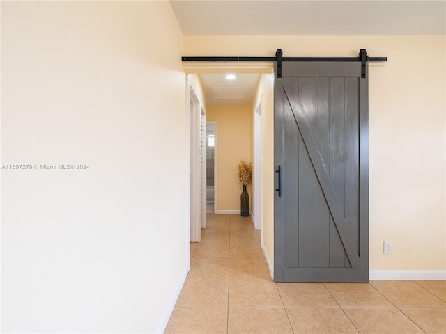 corridor featuring light tile patterned flooring