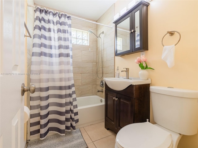 full bathroom featuring tile patterned floors, vanity, toilet, and shower / bath combo with shower curtain