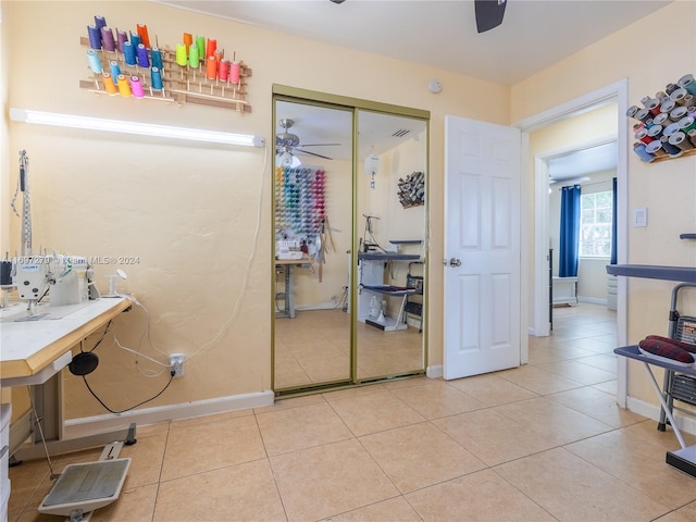 bathroom with tile patterned flooring and ceiling fan