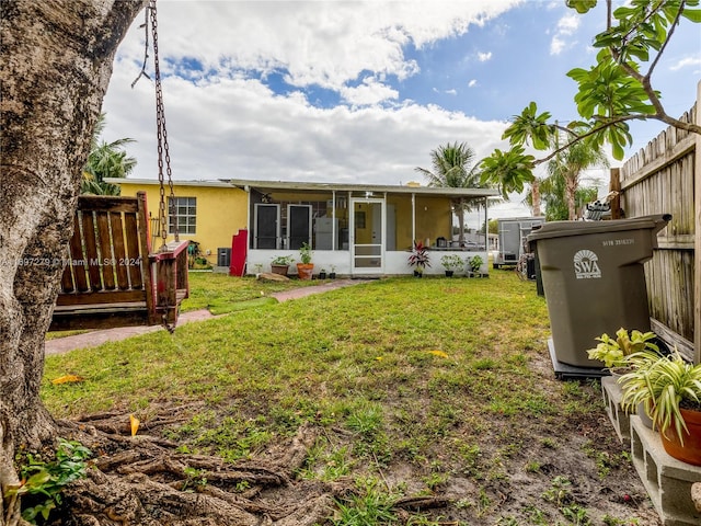 back of house featuring a yard