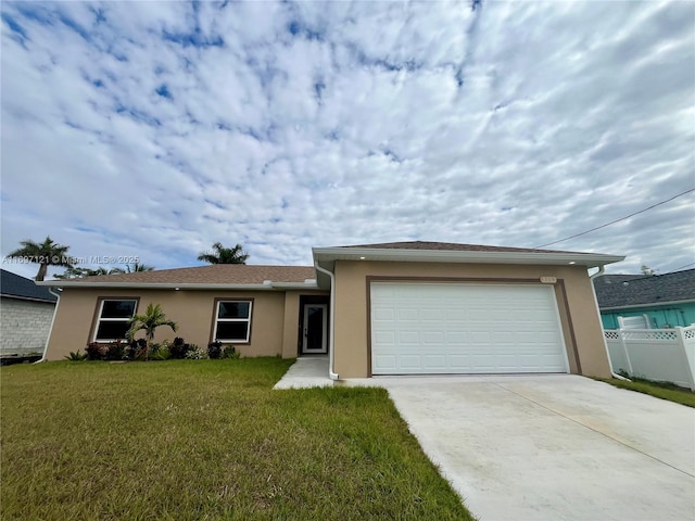 ranch-style home with a garage and a front lawn