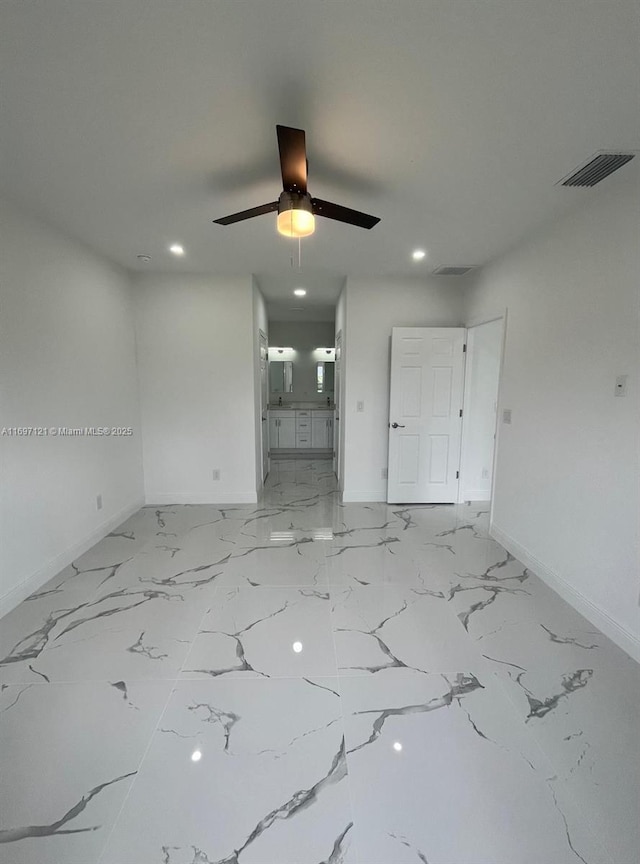 spare room featuring ceiling fan