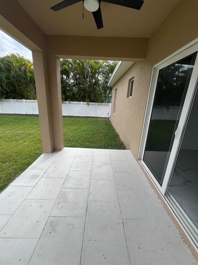 view of patio / terrace featuring ceiling fan