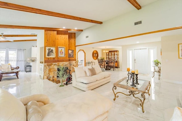 living room with lofted ceiling with beams