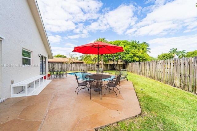 view of patio with a fenced in pool