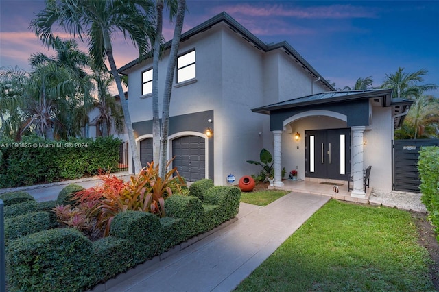 view of front of property with a garage