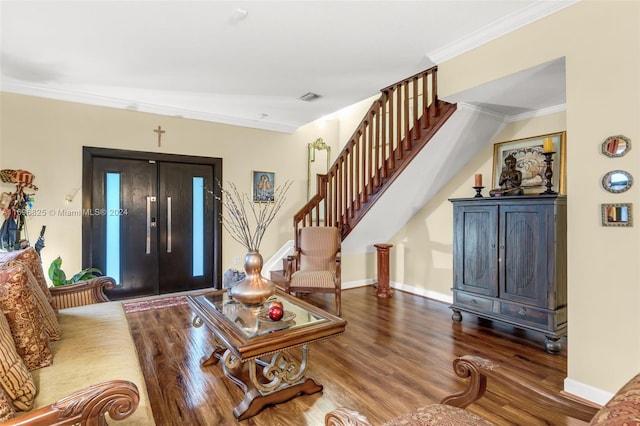 entryway featuring hardwood / wood-style floors and ornamental molding