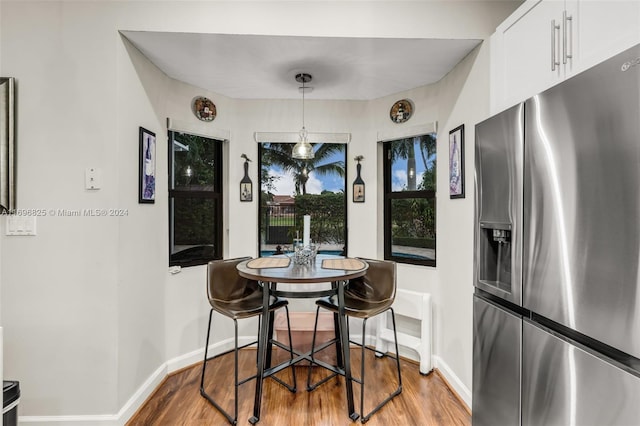 dining space featuring light hardwood / wood-style flooring