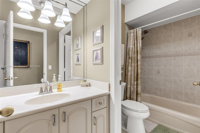 full bathroom with tile patterned flooring, shower / bath combo with shower curtain, vanity, and toilet