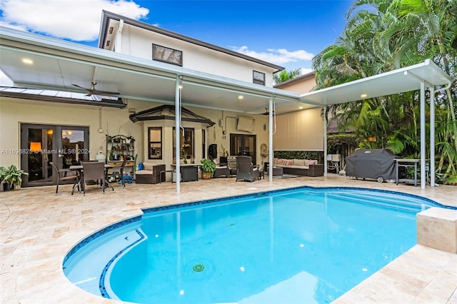 view of pool with a patio area, ceiling fan, and an outdoor hangout area