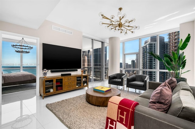 living room featuring tile patterned flooring and a notable chandelier