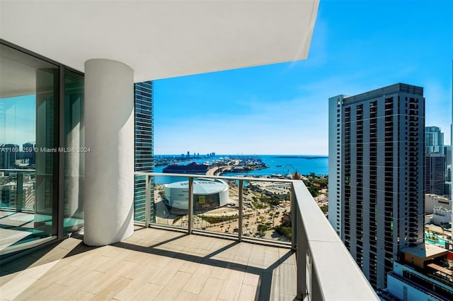 balcony featuring a water view