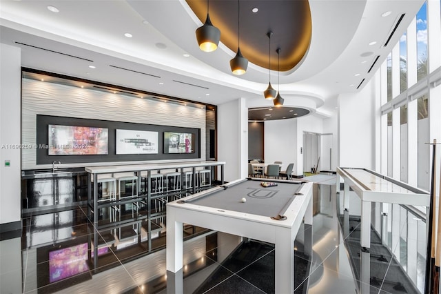 game room featuring a raised ceiling and billiards