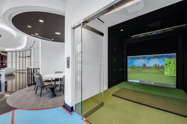 rec room featuring golf simulator and concrete floors