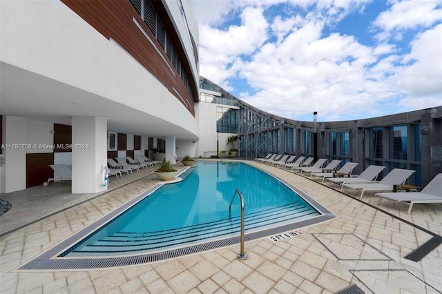 view of swimming pool with a patio