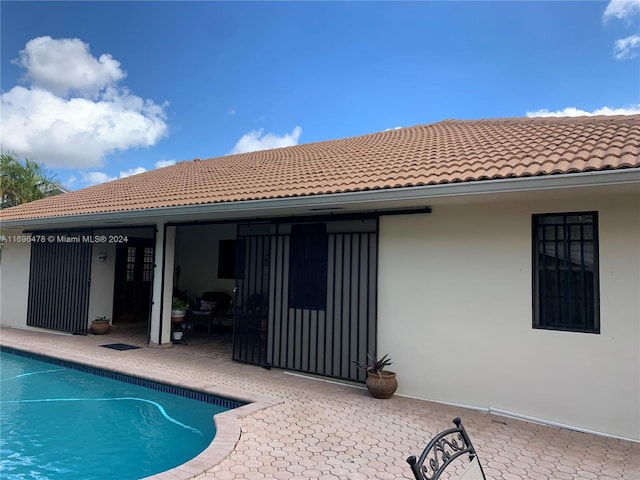 rear view of property featuring a patio