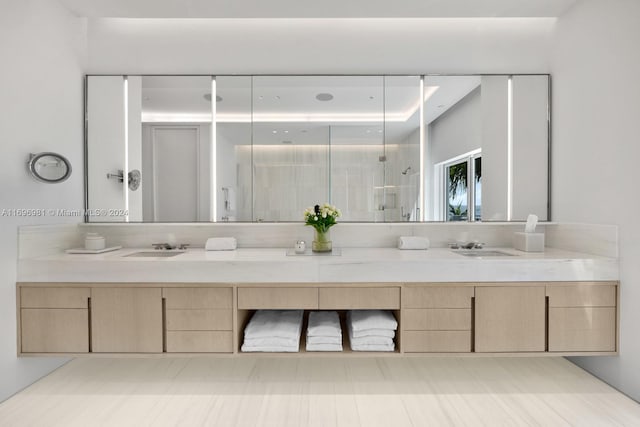 bathroom with a shower and vanity