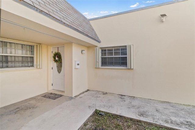 doorway to property with a patio