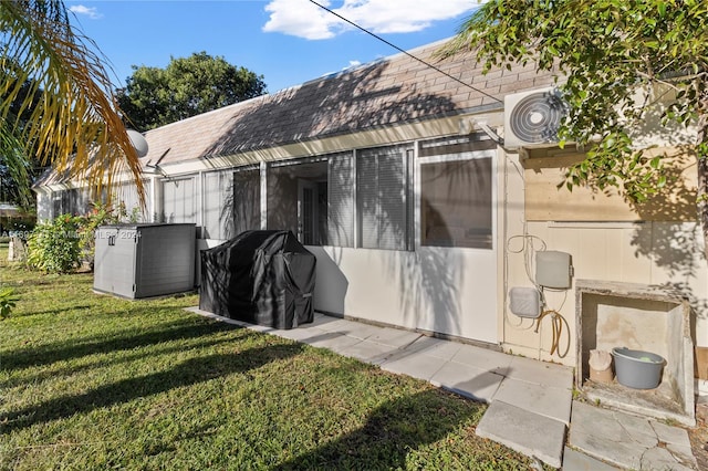 rear view of house with a yard