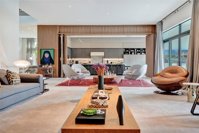 living room featuring carpet flooring and wooden walls