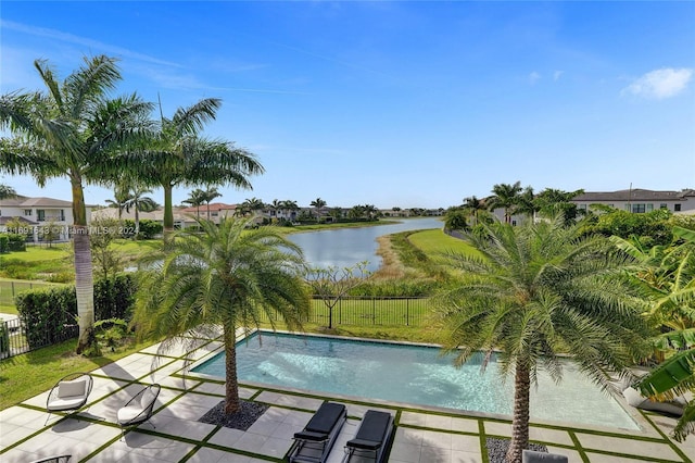 view of swimming pool with a water view