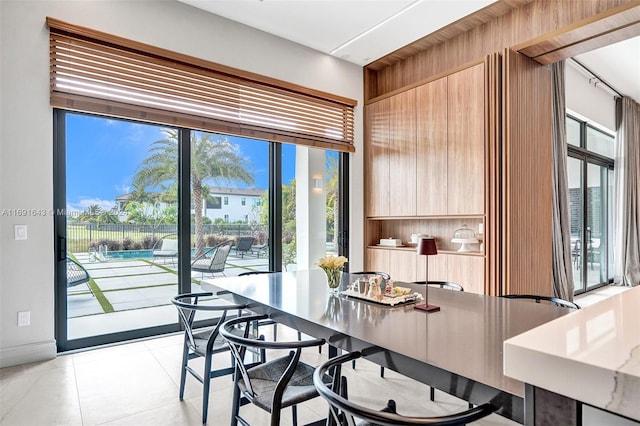 dining area with light tile patterned floors