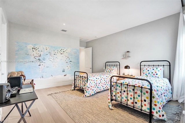 bedroom with light wood-type flooring