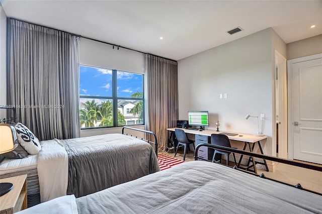 bedroom with hardwood / wood-style flooring