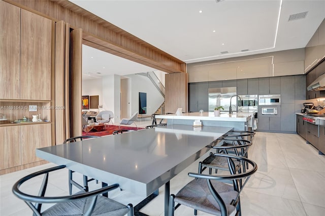 dining area featuring light tile patterned floors