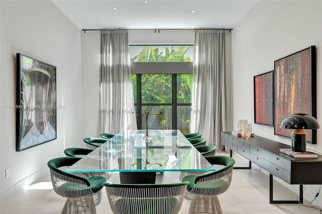 dining space featuring light tile patterned flooring