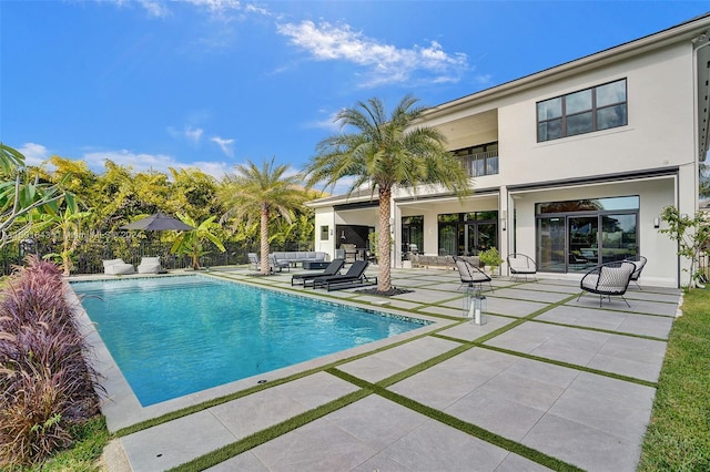 view of pool featuring a patio