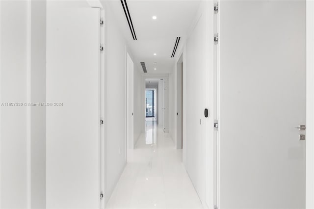 hallway featuring light tile patterned floors