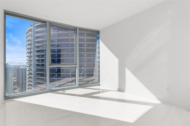 empty room featuring floor to ceiling windows