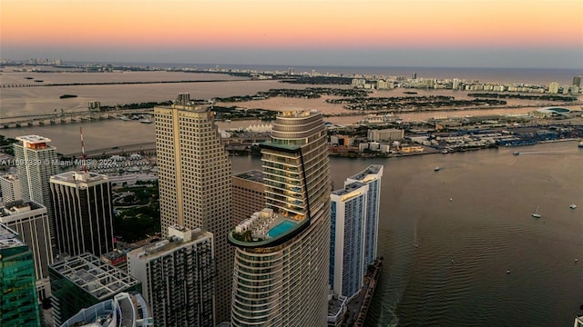 aerial view at dusk with a water view