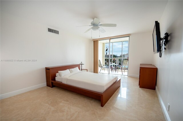 bedroom with light tile patterned floors, access to outside, and ceiling fan