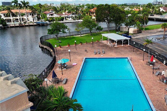 view of swimming pool with a water view