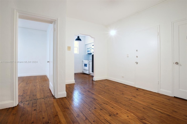 spare room with dark wood-type flooring