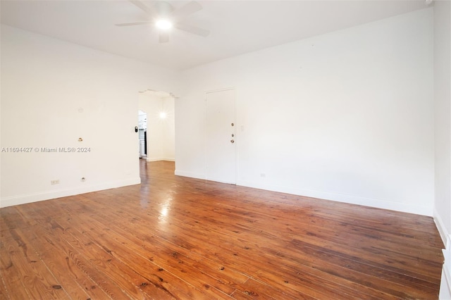 spare room featuring ceiling fan and wood-type flooring