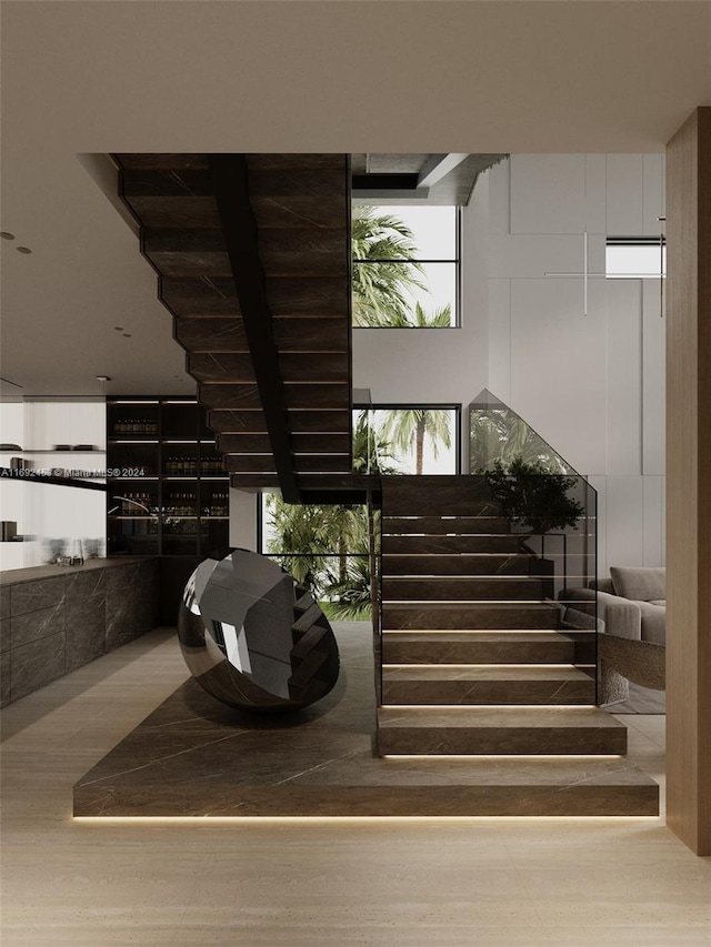 stairway with hardwood / wood-style floors