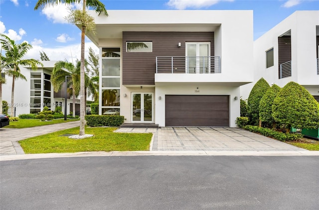 modern home with french doors and a garage