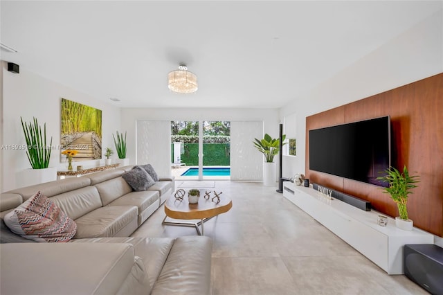 living room with a notable chandelier