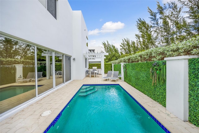 view of pool featuring a pergola and a patio area