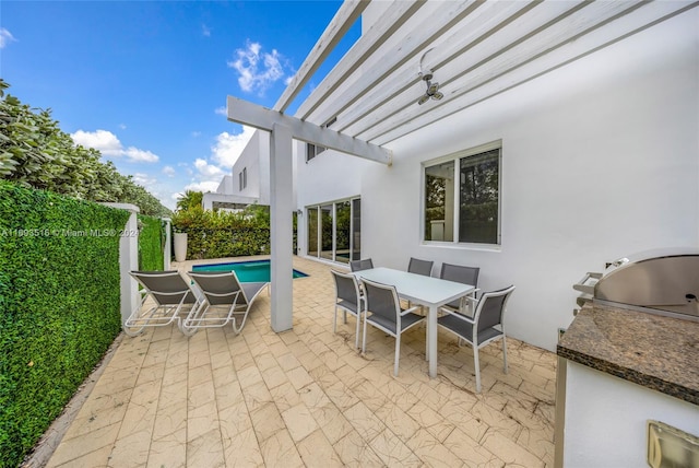 view of patio / terrace with a pergola, a fenced in pool, and area for grilling