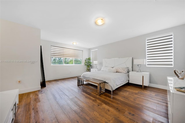 bedroom featuring dark hardwood / wood-style flooring