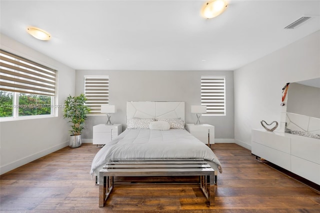 bedroom featuring dark hardwood / wood-style floors