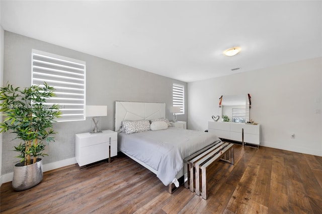 bedroom featuring dark hardwood / wood-style flooring