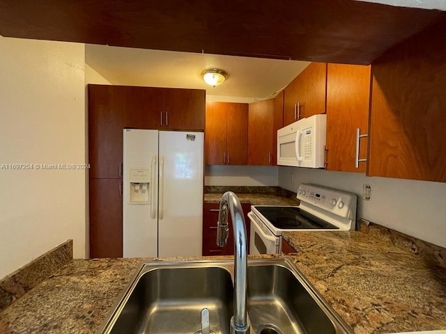 kitchen with white appliances and sink