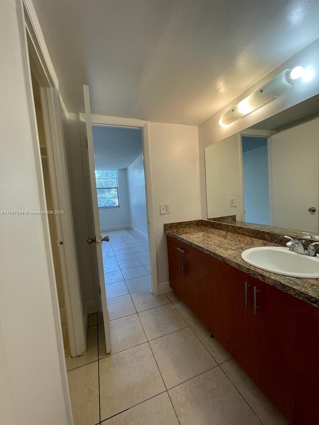 bathroom featuring tile patterned flooring and vanity